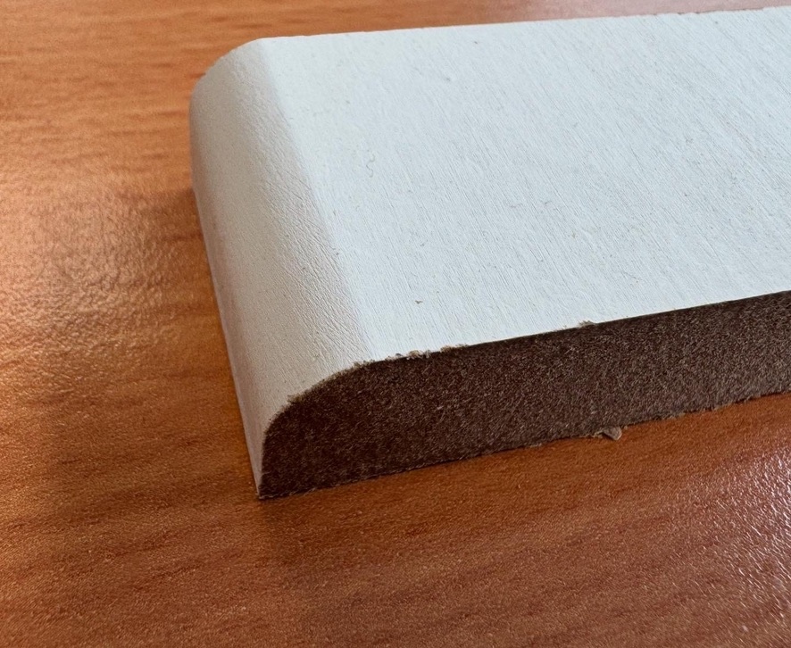 Close-up of factory undercoated MDF skirting board